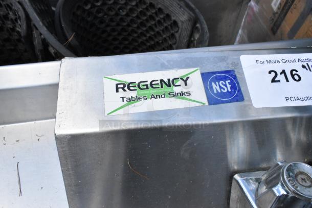 Regency stainless steel wall mount sink, single bay, with faucet and handles. Includes "Regency Tables and Sinks" and NSF labels.