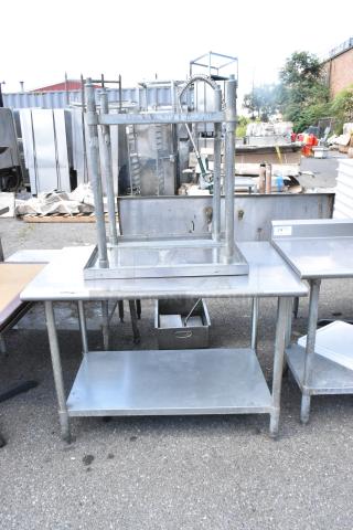 Two stainless steel tables with metal under shelf, sizes 48x30x34 and 30x24x34, used condition.