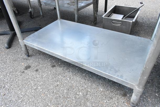 Two stainless steel tables with metal under shelves; sizes 48x30x34 and 30x24x34. Slight wear visible.