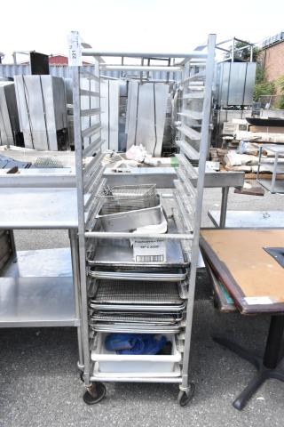 Metal commercial pan transport rack with 12 metal baking pans, on commercial casters. Includes box marked "Foodservice Film."
