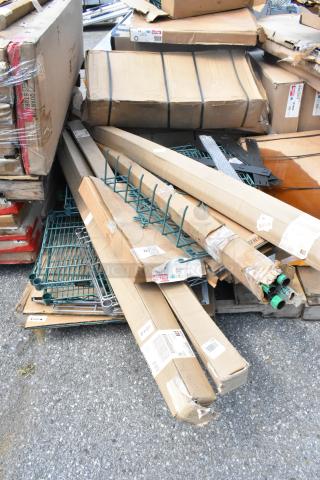 Pallet of new scratch and dent items, including Metro SWS18K3 green wire shelves. Boxes show slight wear.