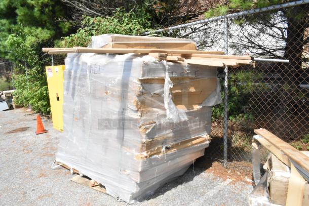 Plastic-wrapped pallet of 42 scratch and dent items, including 2448GY 24x48 wire shelves and P74GY poles, outdoors.