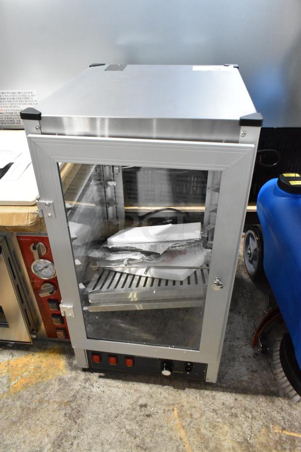Brand new Carnival King HPW-12D2S 12" warmer, scratch and dent condition, 115V, 1 phase, glass front, control knobs visible.
