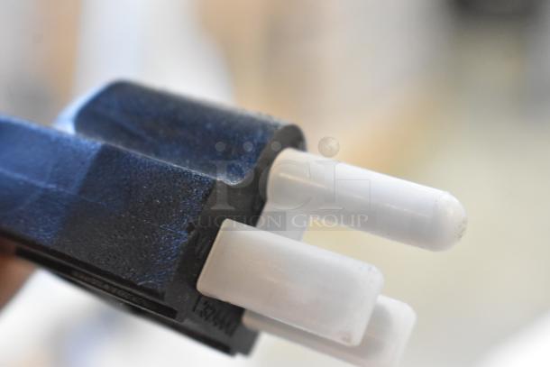 Close-up of a plug connector component, not part of the Avantco 177VB203 stainless steel gas vertical broiler.