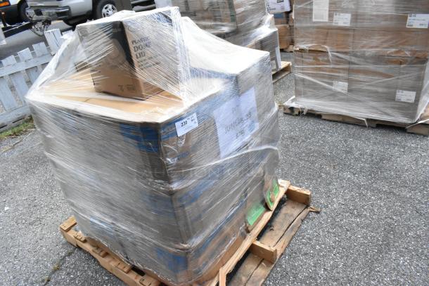 Pallet of 12 scratch-and-dent items, plastic lids, cups, paper towel rolls. Wrapped in plastic, visible box labels.