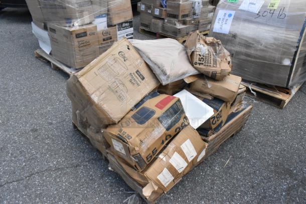 Pallet of scratch and dent items, including shelf kit, aluminum trays, and stock pot. Boxes show wear, mixed condition.