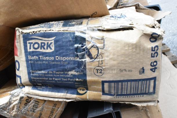 Tork bath tissue dispenser box, mini jumbo roll, stainless steel, scratch and dent condition, visible barcode and product details.