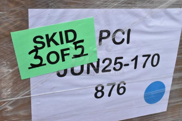 Skid label showing "3 of 5" on wrapped pallet with shipping info tags, indicating auction items containing Carlisle RG9-414 racks.