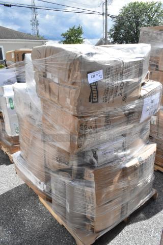 Pallet with wrapped boxes containing 33 scratch and dent items: plastic plates, paper towels, trays, gloves, cups. Labels visible.
