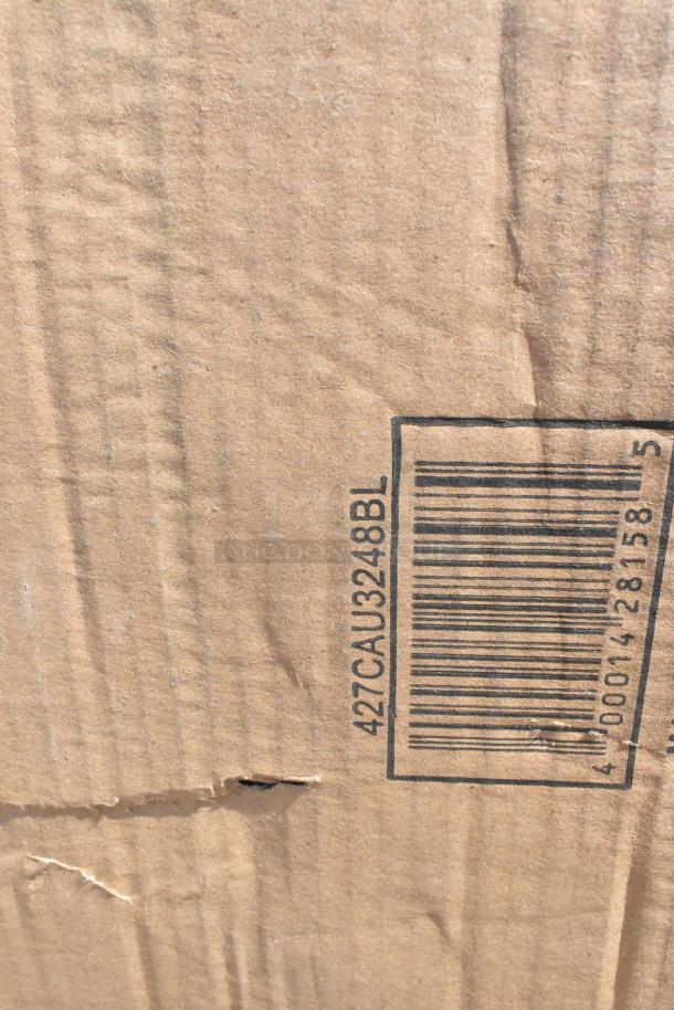 Cardboard box with visible barcode and code "427CAU3248BL," indicating packaging for auction items in new condition, with minor dents.