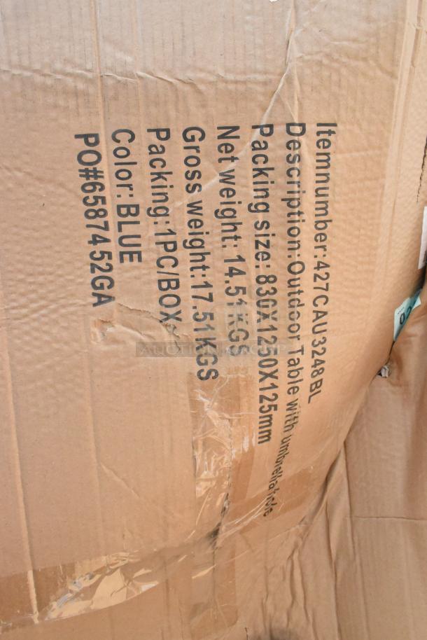 Cardboard box with printed details for an outdoor table, color blue, showing minor signs of wear.