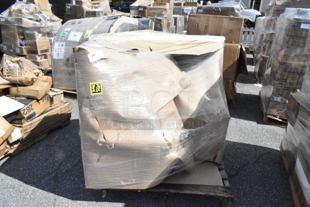 Plastic-wrapped booth in brand new scratch and dent condition, visible cardboard packaging, stored on a pallet. Auction lot 240.