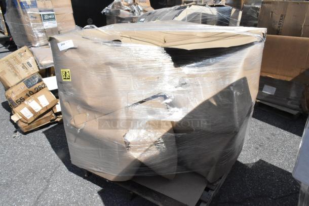 New booth wrapped in plastic, labeled "Scratch and Dent." Packaging slightly damaged, visible wear from transport.