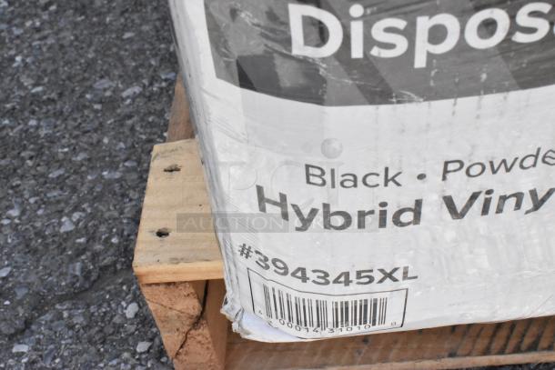 "Disposable hybrid vinyl gloves package on wooden pallet, labeled black powder-free, item #394345XL."