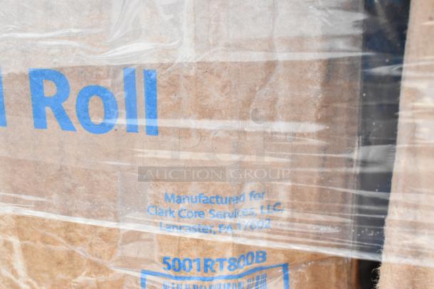 Plastic-wrapped box labeled "Manufactured for Clark Core Services, LLC, Lancaster, PA 17602." Contains frozen yogurt cups, teaspoons, lids.