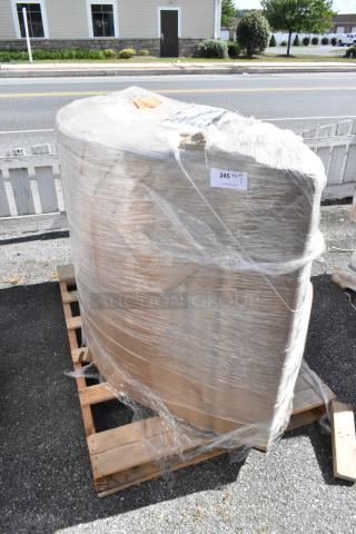 Brand new booth wrapped in plastic, labeled "245 QTY 1," showing minor scratches and dents, on wooden pallet.