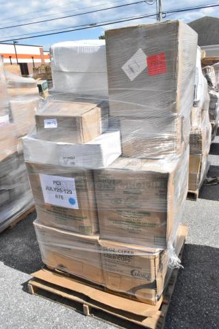 Shrink-wrapped pallet with boxes of cold cups, register printer rolls, and to-go containers labeled "PCI JULY25-129 876."
