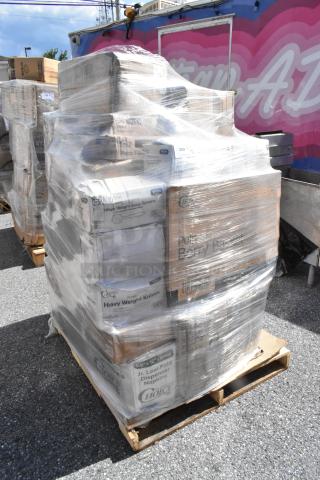 Stack of boxed items wrapped in plastic on a pallet, including napkins, lids, produce baskets, and more, labeled "Choice."