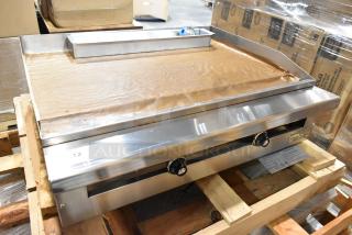 Brand new Therma-Tek TC36-36TGL stainless steel propane flat top griddle on a pallet. Unused, still in box.