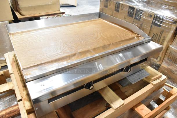 Brand new 2021 Therma-Tek TC36-36TGL stainless steel propane gas griddle, in original packaging, with control knobs visible.