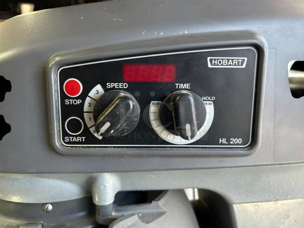 Hobart HL200-10STD Legacy+ mixer control panel showing speed and time knobs, "HOBART" label visible.