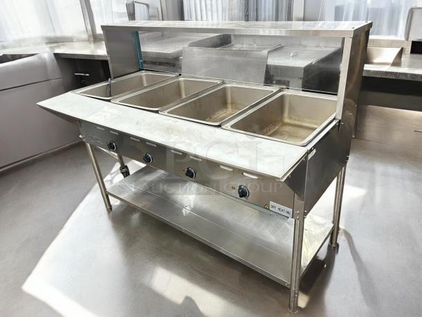 Avantco STE-4SGA four-pan electric steam table with undershelf, overshelf, and sneeze guard, 120V, tested, working.
