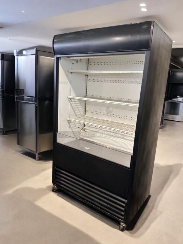 True TAC-48 air curtain merchandiser, excellent condition, black exterior, multiple shelves, fully tested, 208/230V.