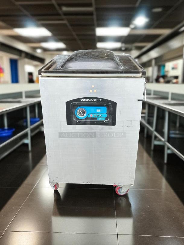 VacMaster VP540 vacuum sealer, stainless steel, on wheels, digital control panel, industrial use, visible wear.