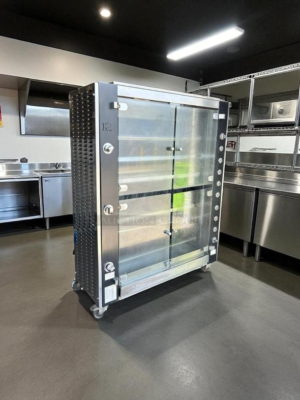 Stainless steel commercial glass display cabinet on wheels, excellent condition, with adjustable shelves and locking mechanism.