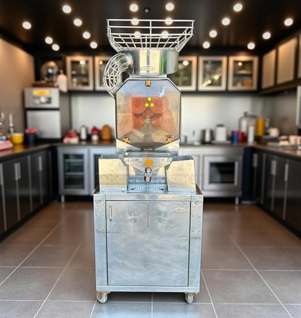 Commercial coffee grinder, Etronic brand, model 134, stainless steel finish, on wheels. Excellent condition, visible brand logo.