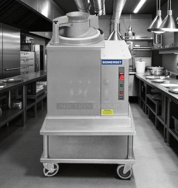 Somerset dough sheeter in stainless steel, excellent condition, mounted on wheels for mobility, control panel with buttons.