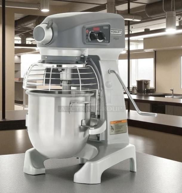 Hobart commercial mixer, model 136, in excellent condition. Features a stainless steel bowl, control panel, and safety guard.