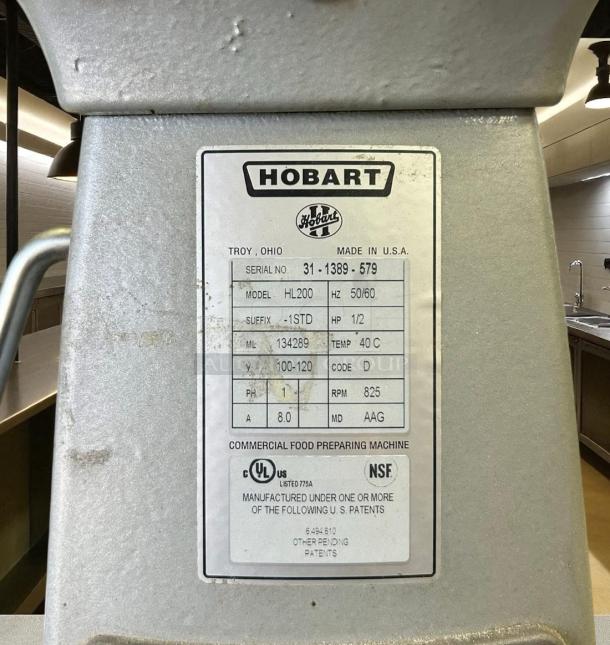 Hobart HL200 commercial food preparing machine label showing specs: Model HL200, serial 31-1389-579, 1/2 HP, 825 RPM.