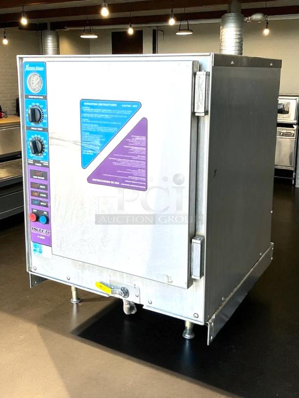 Industrial steam oven with stainless steel exterior, control knobs, and instruction labels. Used condition. Model: Xtreme Steam Intck.