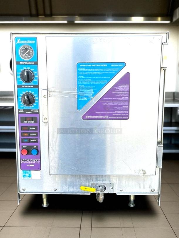 Xtreme Steam model 142 commercial steamer, stainless steel, temperature controls, operation instructions visible, good condition.