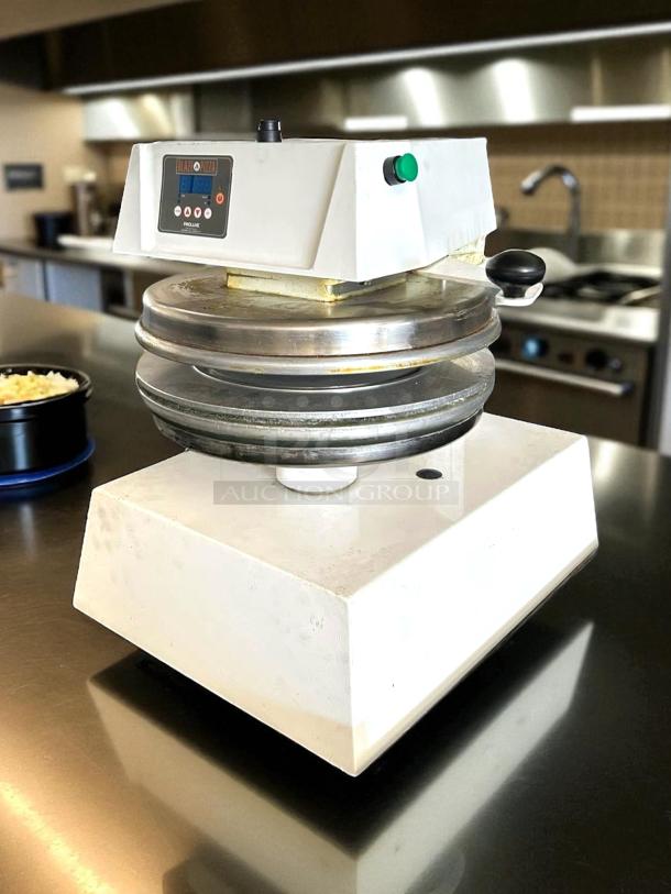 Proluxe Pizza Dough Press, model 144, in working condition. Features temperature control and digital display. Slight wear visible.