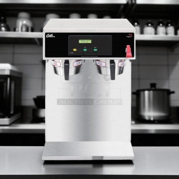 Commercial coffee brewer with dual dispensers, digital controls, and stainless steel finish. Model 154, excellent condition.