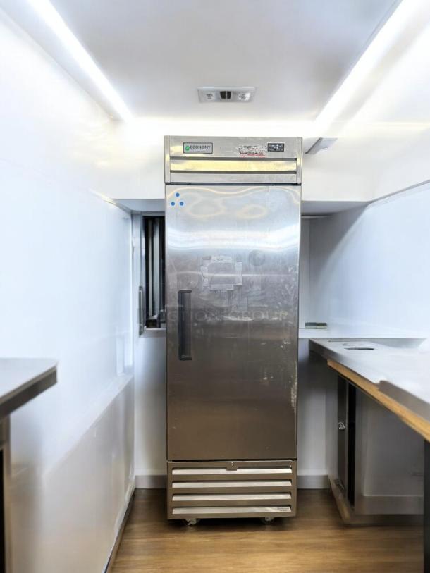 Economy Series EF1A-FS single door commercial freezer, excellent condition, 115V, fully tested, stainless steel, on wheels.