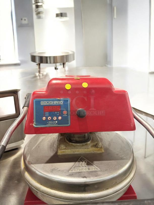 DoughPro ProLuxe pizza dough press, excellent condition, digital control, heated platens, 120V, fully tested and working.