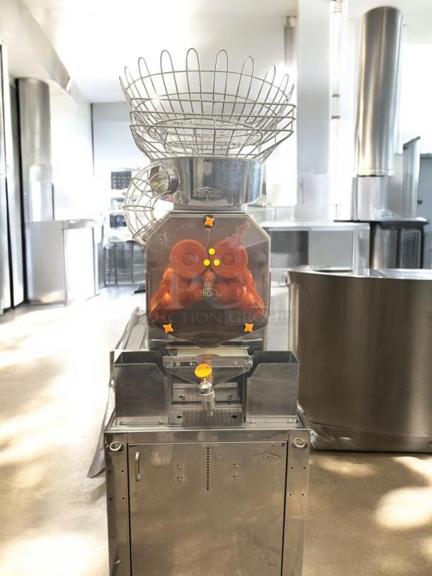 Citrocasa Commercial Pro Juicer, stainless steel, floor model with cabinet base, excellent condition, 120V, fully tested.