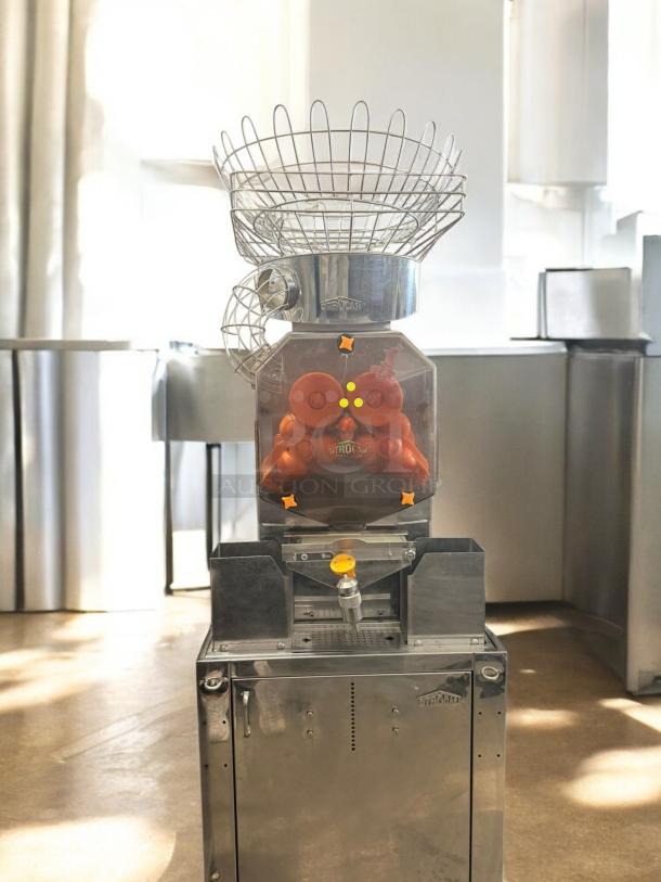 Citrocasa Commercial Pro Juicer, stainless steel, excellent condition, fully tested, floor model with cabinet base, 120V.