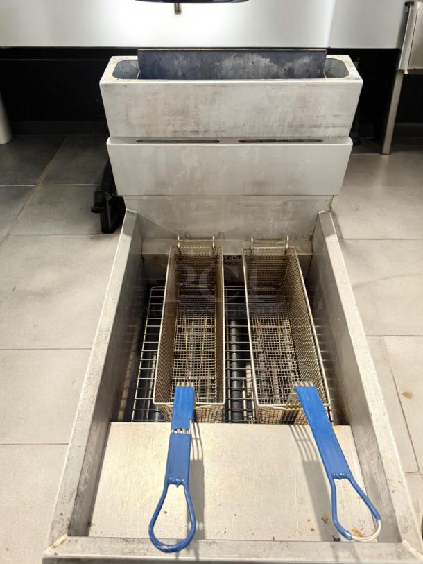 Pitco 65C+S 65 lb natural gas fryer, excellent condition, floor model, tested and working, with blue-handled baskets.