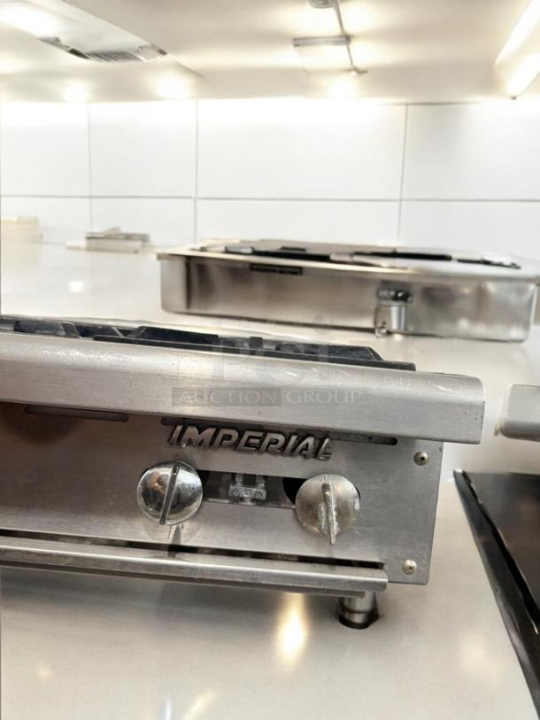 Imperial 6-burner gas hot plate in excellent condition, natural gas, 120V ignition, fully tested, model branding visible.