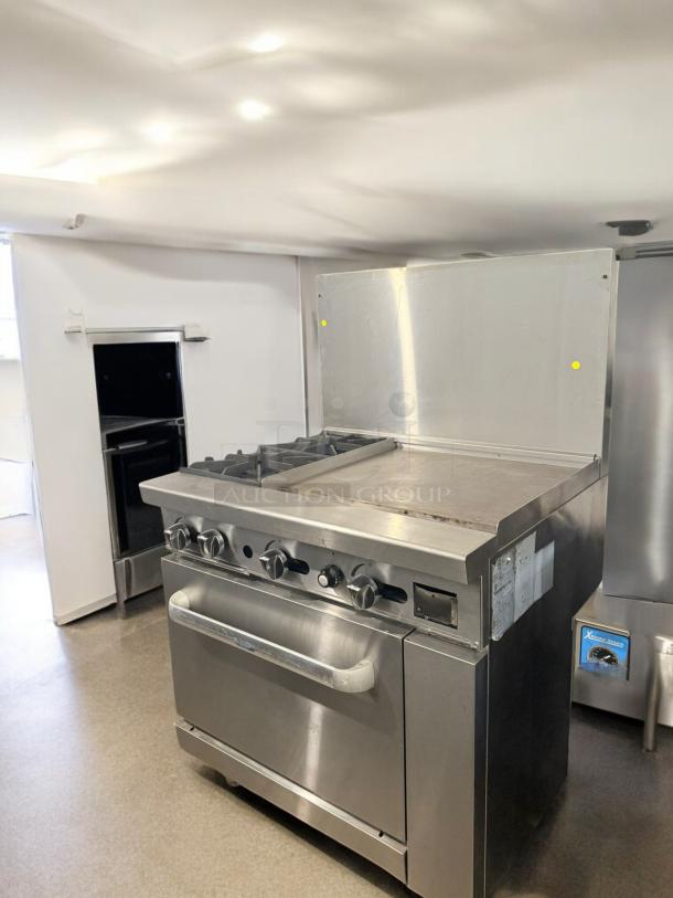 American Range 36" gas range, model ATO-2824, with 2 burners, 24" griddle, standard oven; excellent condition, tested.