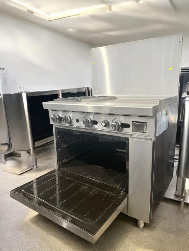 American Range ATO-2824 36" gas range with 2 burners, 24" griddle, standard oven; excellent condition, fully tested.