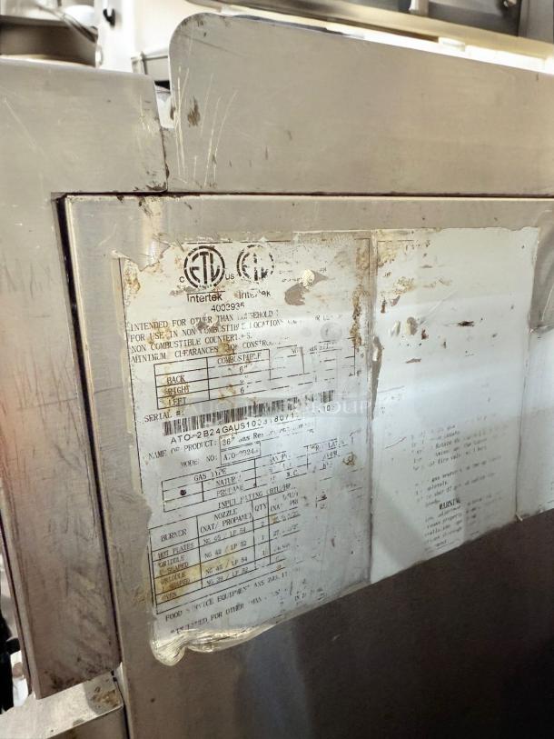 American Range ATO-2824 36" Gas Range label, showing model, serial number, and specifications.