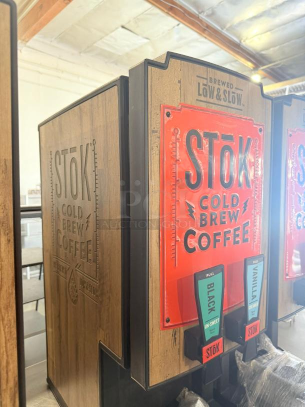 STōK Cold Brew Coffee Dispenser, Dual Flavor, 120V, excellent condition, wood finish, labeled for black and vanilla.