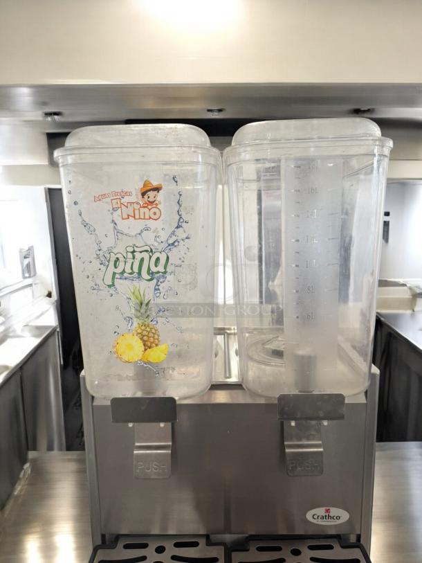 Crathco Dual Bowl Beverage Dispenser, Classic Series. Clear bowls, 120V, excellent condition. Pineapple branding on left bowl.