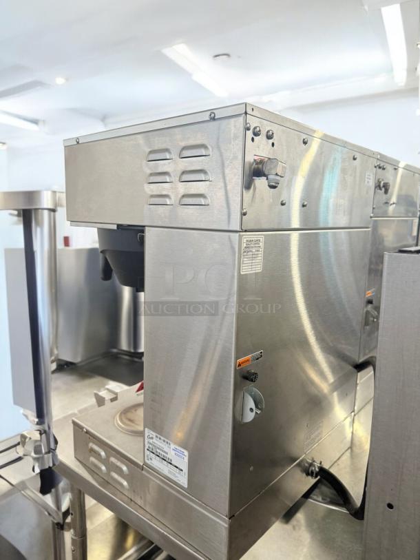 Curtis GEMTS10A1000 Gemini Twin Coffee Brewer, stainless steel, excellent condition, 220V, fully tested, side view.
