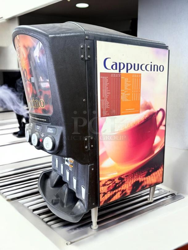 Grindmaster 5-Flavor Cappuccino Dispenser, excellent condition, 120V, fully tested, with flavor buttons and colorful graphics.